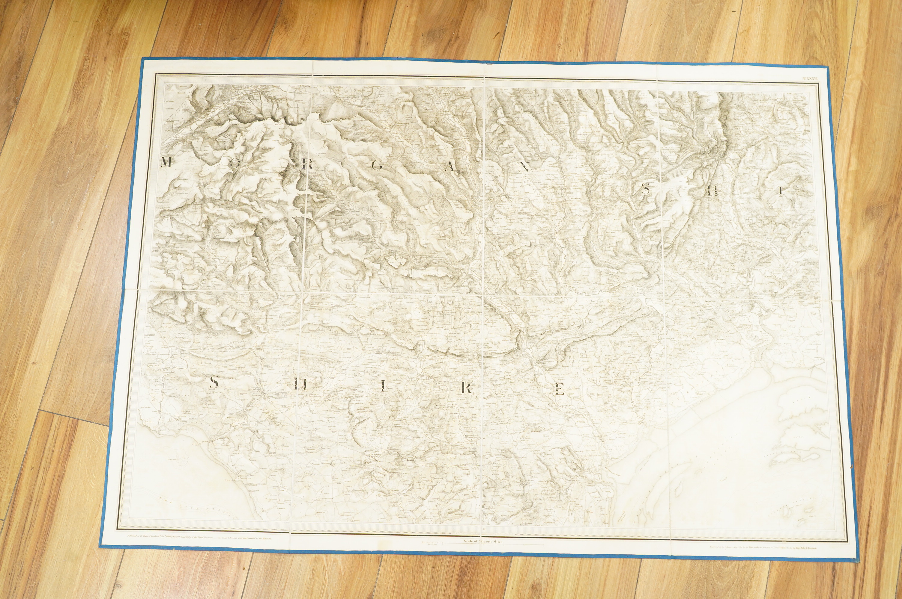 Ordnance Survey maps, comprising of a set of eight engraved maps mounted on linen and each edged with blue cotton, covering N. Wiltshire, S. Gloucester, Monmouth, Glamorgan, and Pembroke, sheet no.s; 36, 37, 38, 39, 40,